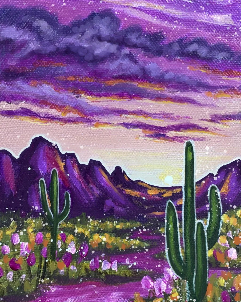 Desert landscape washed in pinks and violets with saguaros and wildflowers, painting by Brigitte De Marco