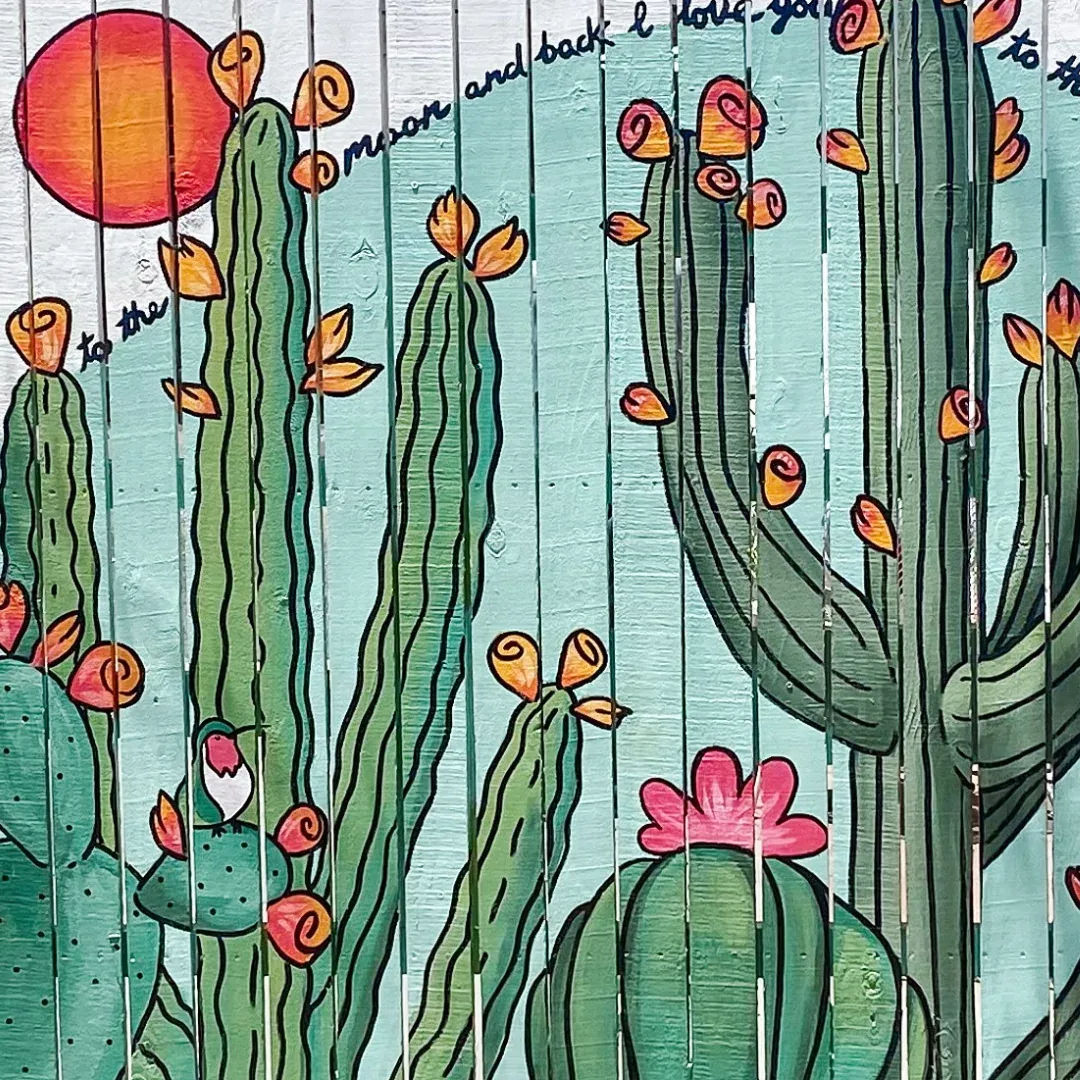 Flowering cactus fence mural in the Garfield Historic District by Brigitte De Marco