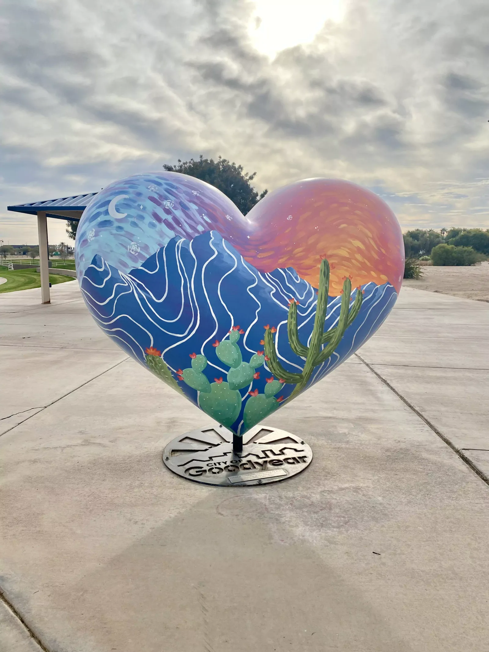 HeArt of Goodyear painted heart sculpture by Brigitte De Marco on its City of Goodyear base