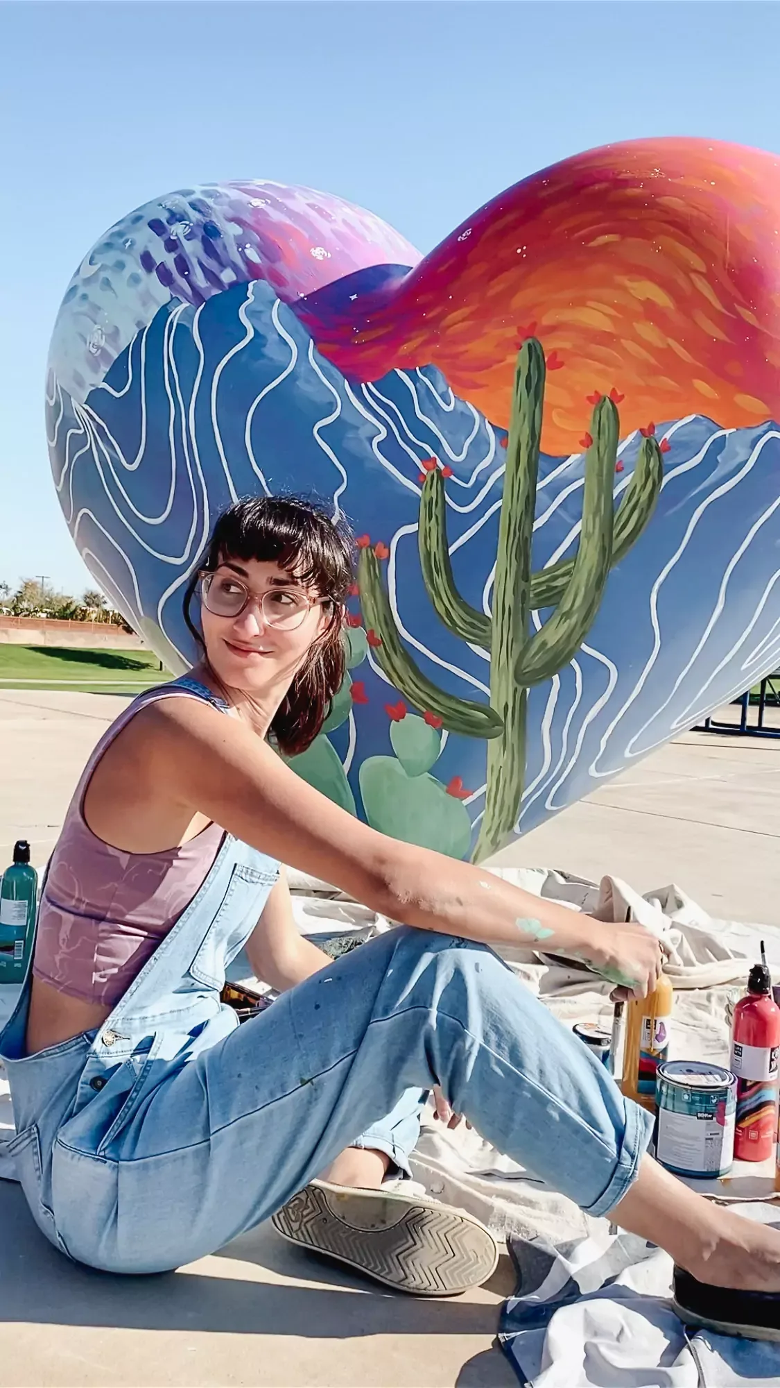 Brigitte De Marco painting the HeArt of Goodyear sculpture for the City of Goodyear